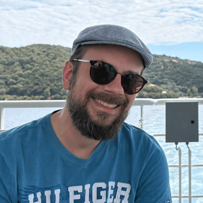 Head and shoulders photograph of Alex Tolios-Zisos