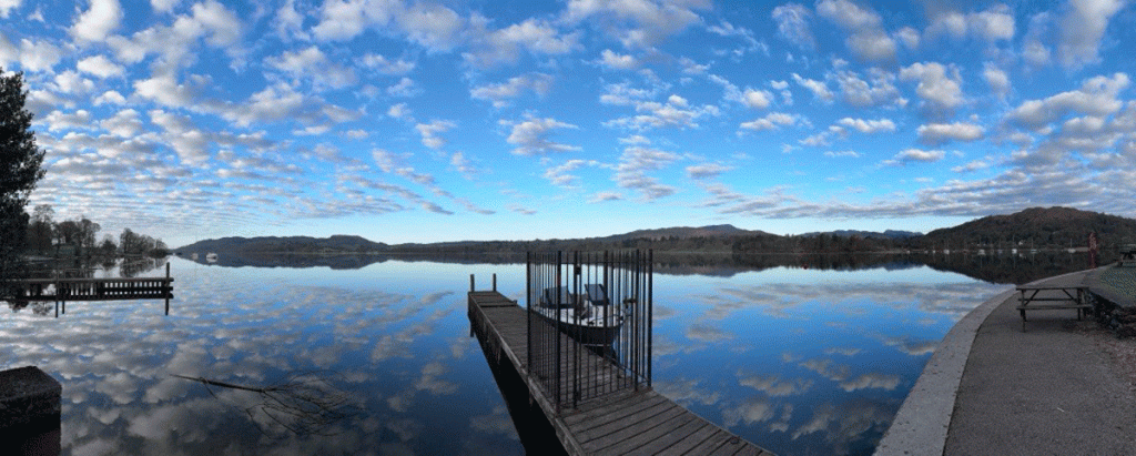 Photograph of Lake Windermere with a bright blue sky