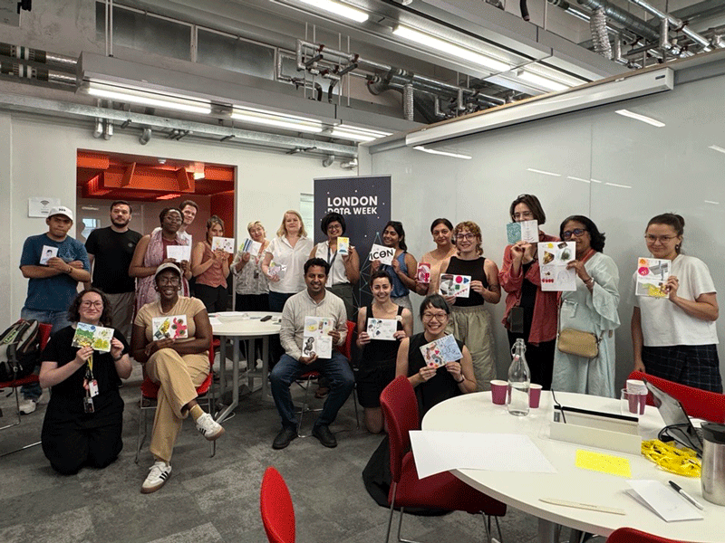 Attendees at the Fold, Encode, Reflect session as part of London Data Week show their finished data zines.